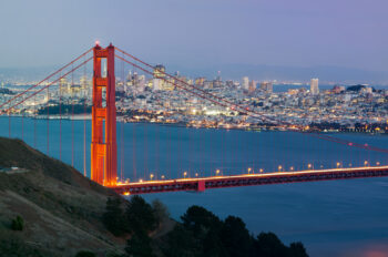 Image of Golden Gate Bridge with San Francisco skyline in the background.