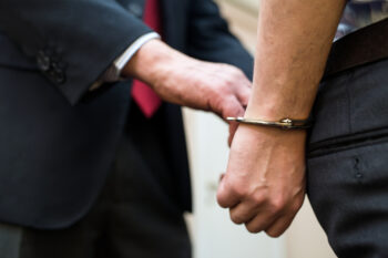 Agent arresting a businessman