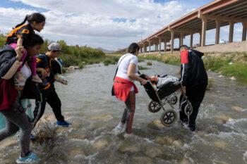 Juarez, Mexico 10-21-2022: Venezuelan migrants cross the Rio Grande, the natural border between Mexico and the United States, families seek to request asylum.