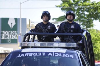LOS MOCHIS, MEXICO - Nov 20, 2019: 2 police officers during civic military parade on independence day in 20th of november