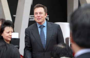 --FILE--Tesla CEO Elon Musk is pictured during a delivery ceremony at the sales center of Tesla in Jinqiao, Shanghai, China, 23 April 2014.

Tesla CEO Elon Musk and the electric car company have agreed to pay a total of $40 million and make a series of concessions to settle a government lawsuit alleging Musk duped investors with misleading statements about a proposed buyout of the company. Tesla and Musk will each pay $20m to settle the case. The settlement will require Musk to relinquish his role as chairman for at least three years, but he will able to remain as CEO. The Securities and Exchange Commission announced the settlement Saturday, just two days after filing a case seeking to oust Musk as CEO. *** Local Caption ***